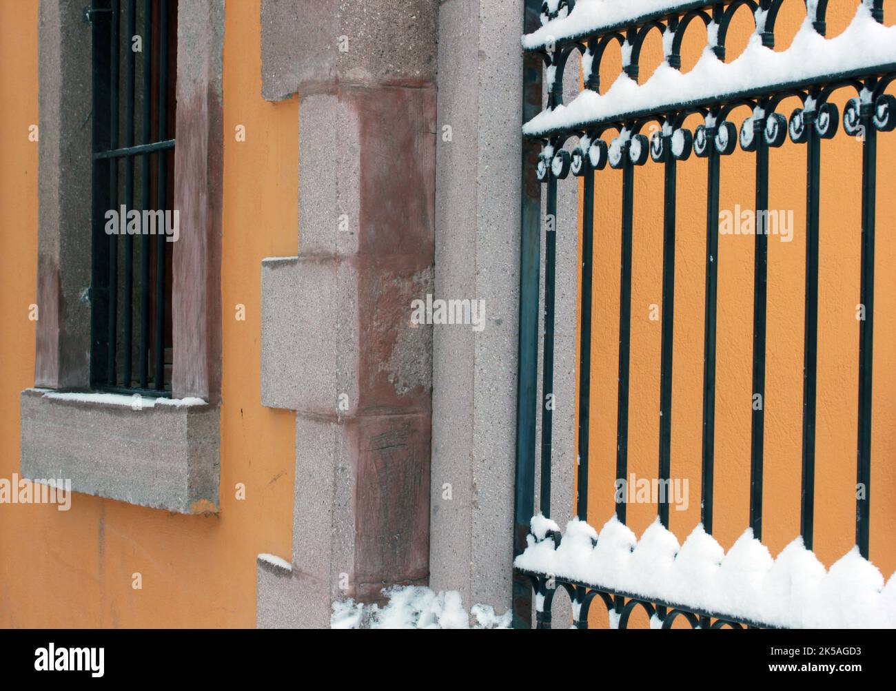 snow covered iron fence of stone building Stock Photo - Alamy