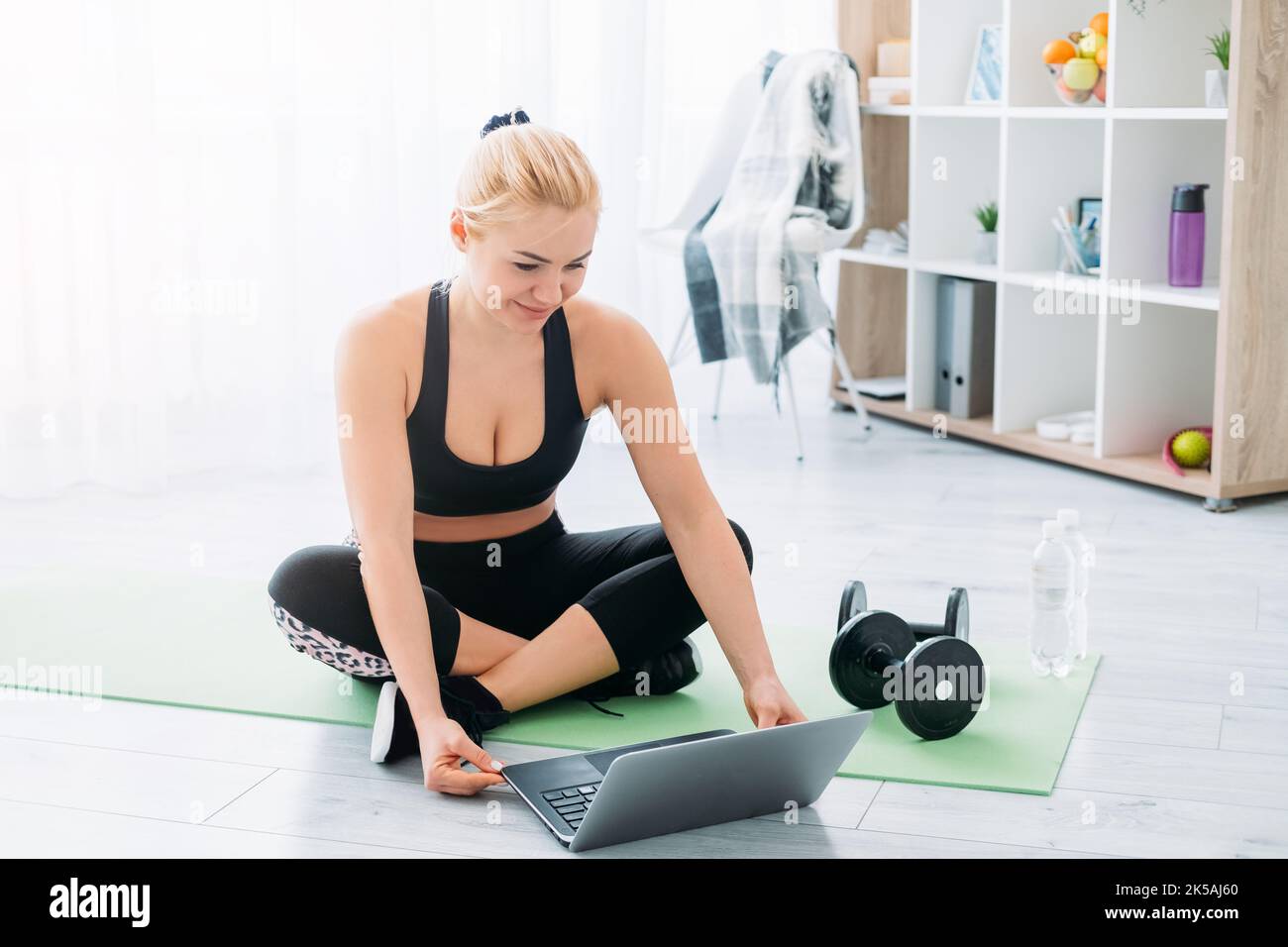 online sport athletic woman home gym healthy Stock Photo