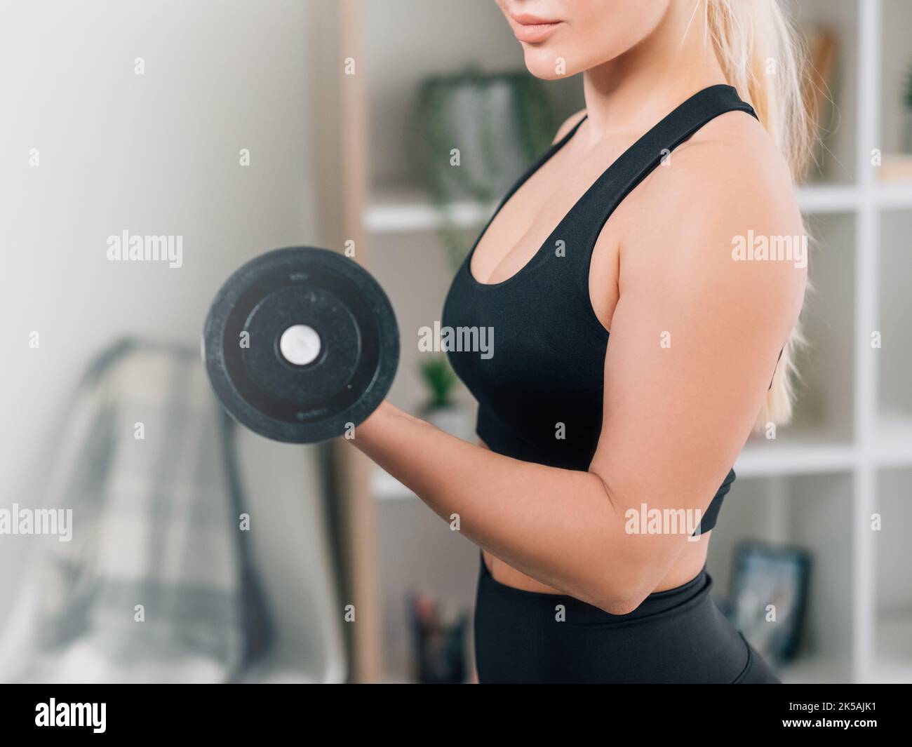 bodybuilding fitness athletic woman home training Stock Photo