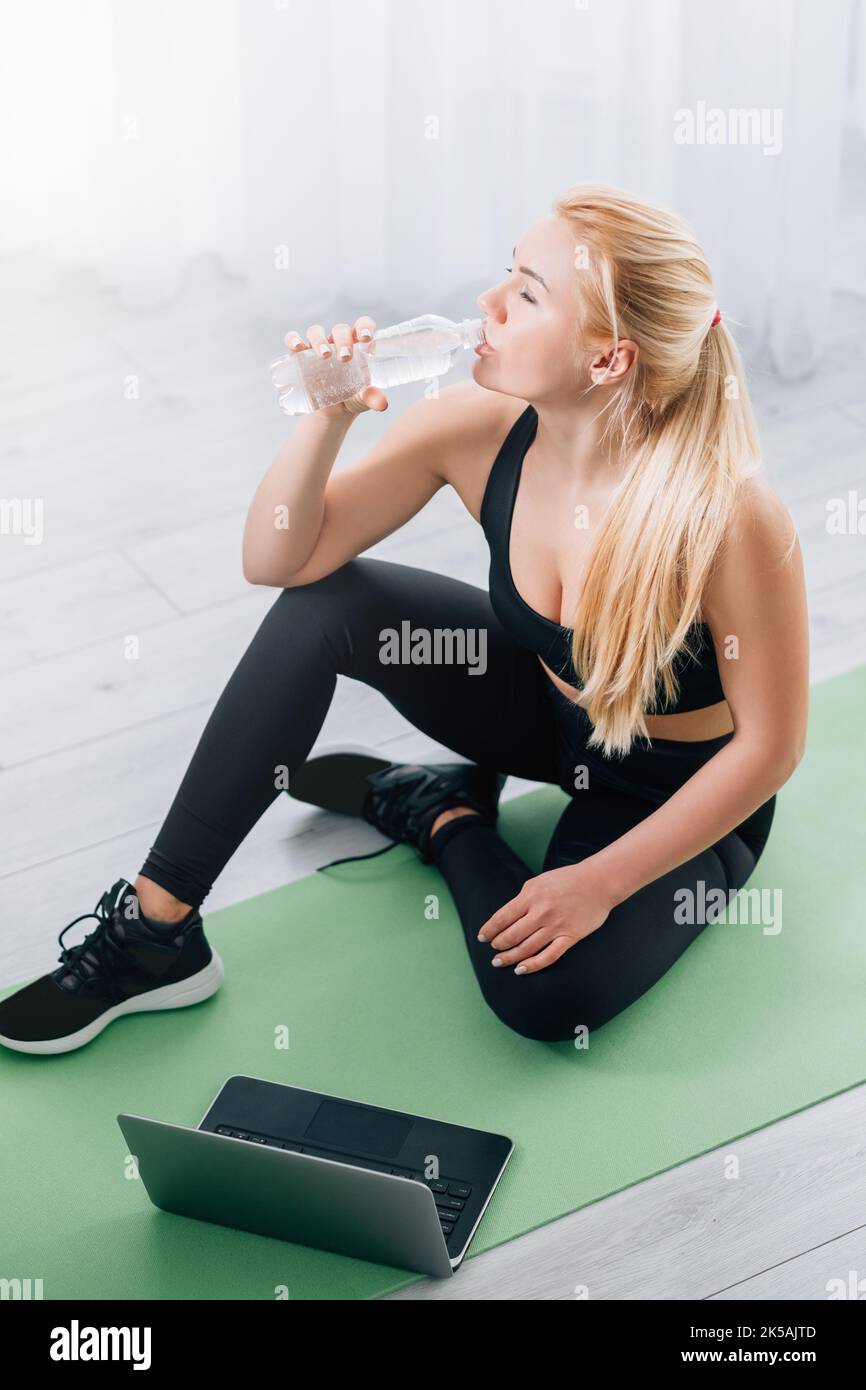 exhausted training thirsty woman home sport Stock Photo