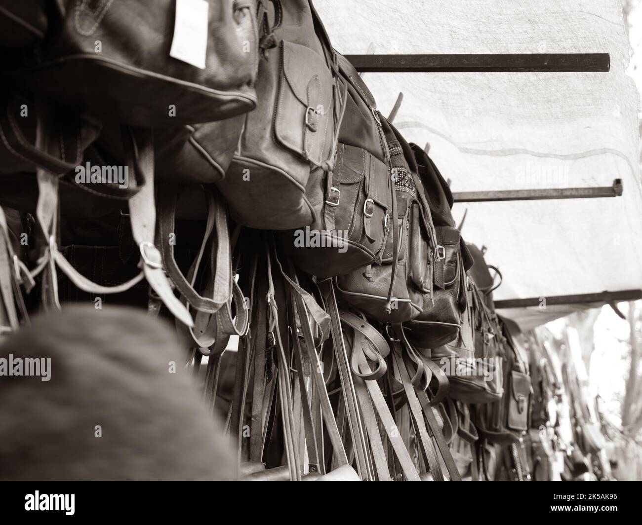 Handy Many Backpack View of many backpacks and bags for sale at an outdoor market Stock ...