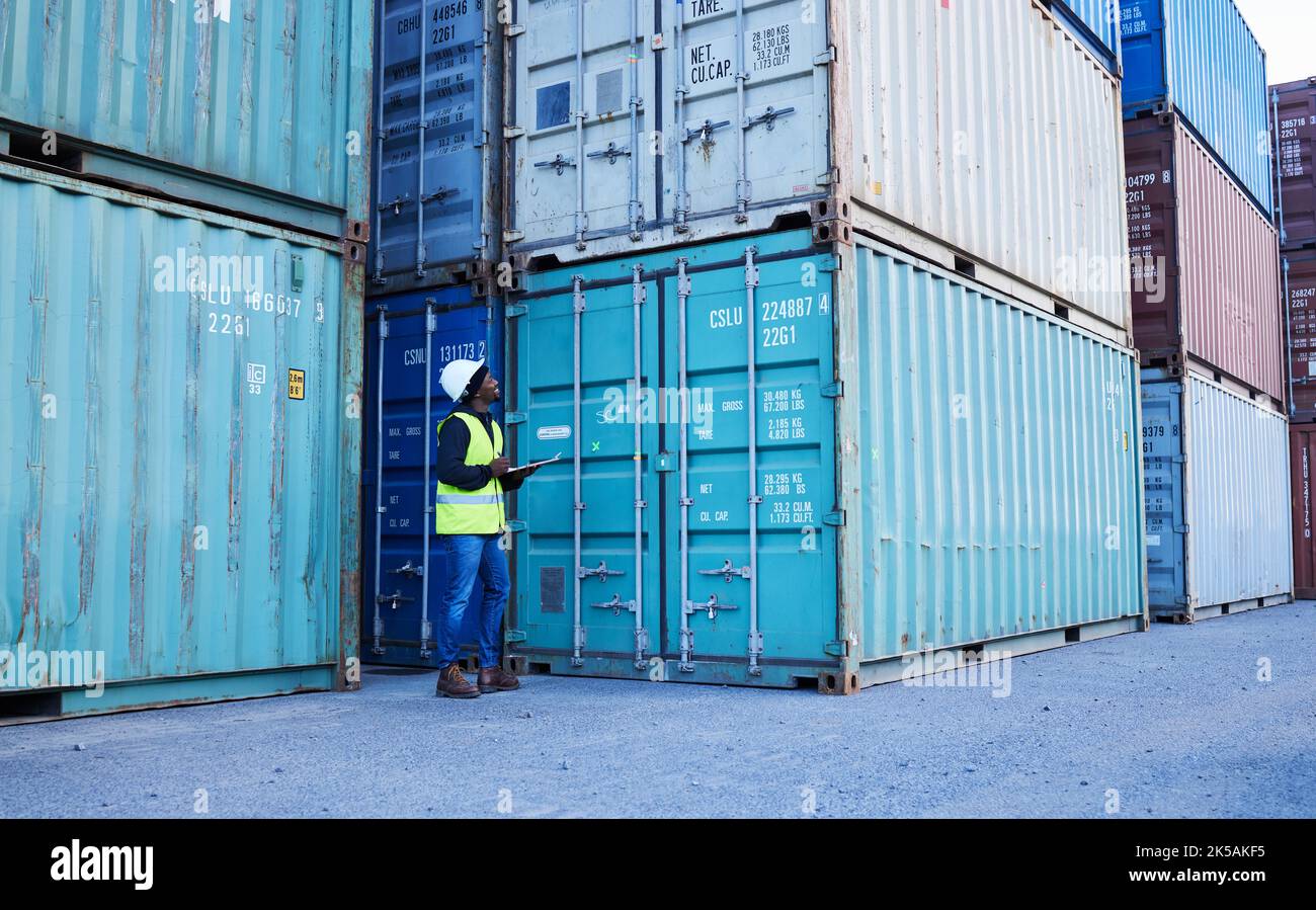 Shipping, stock and cargo management with man writing checklist at