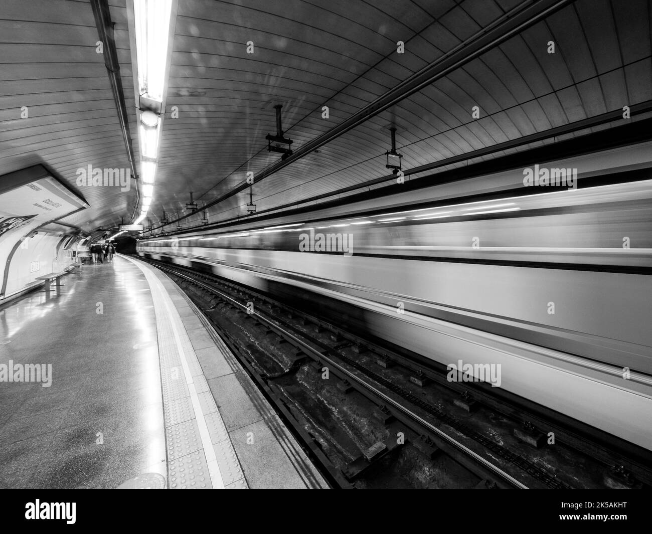 Black and white photograph of the subway train leaving the station