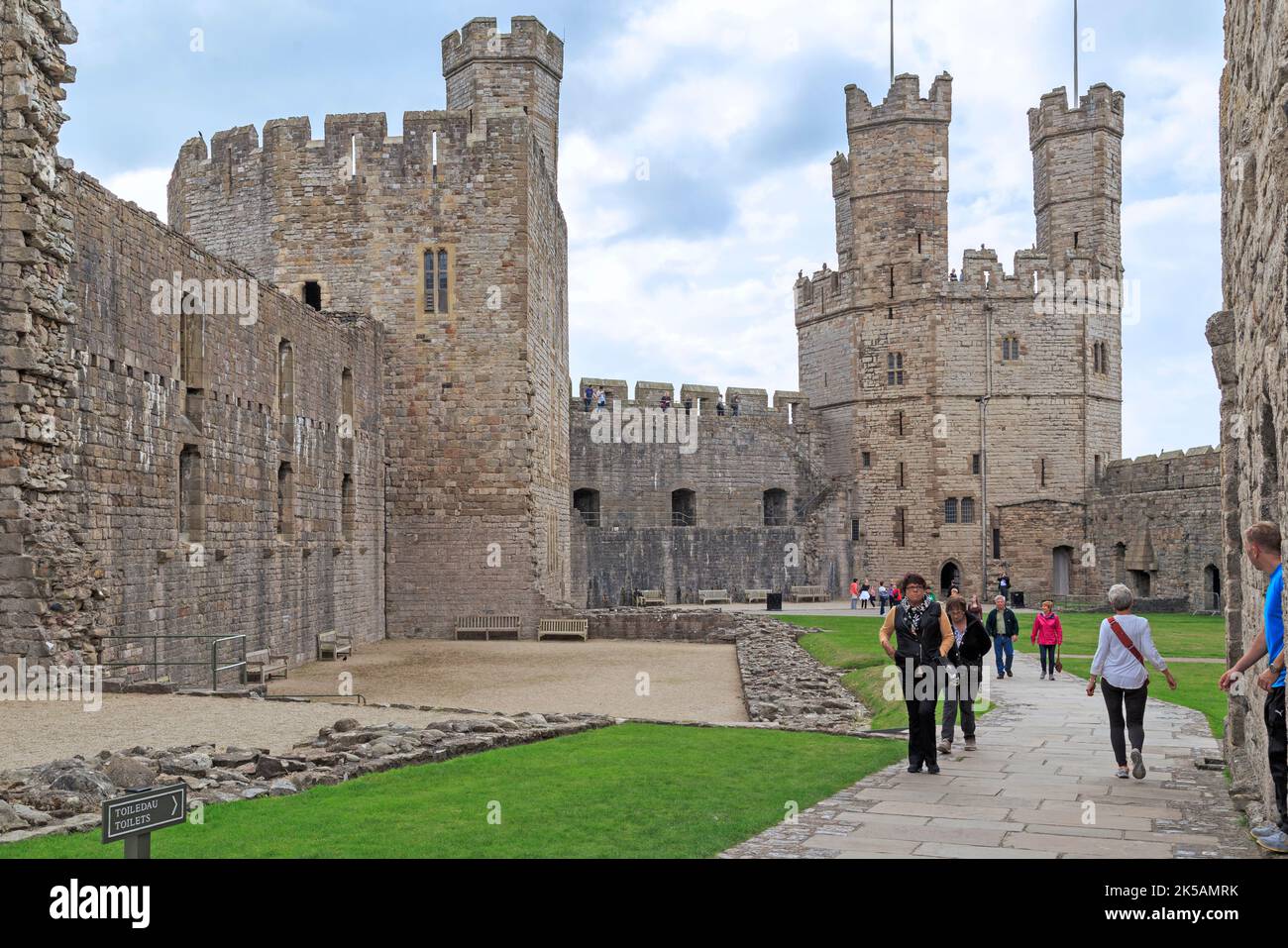 CAERNARFON, GREAT BRITAIN - SEPTEMBER 14, 2014: This is the courtyard of Caenarfon Castle, an outstanding example of the medieval architecture. Stock Photo