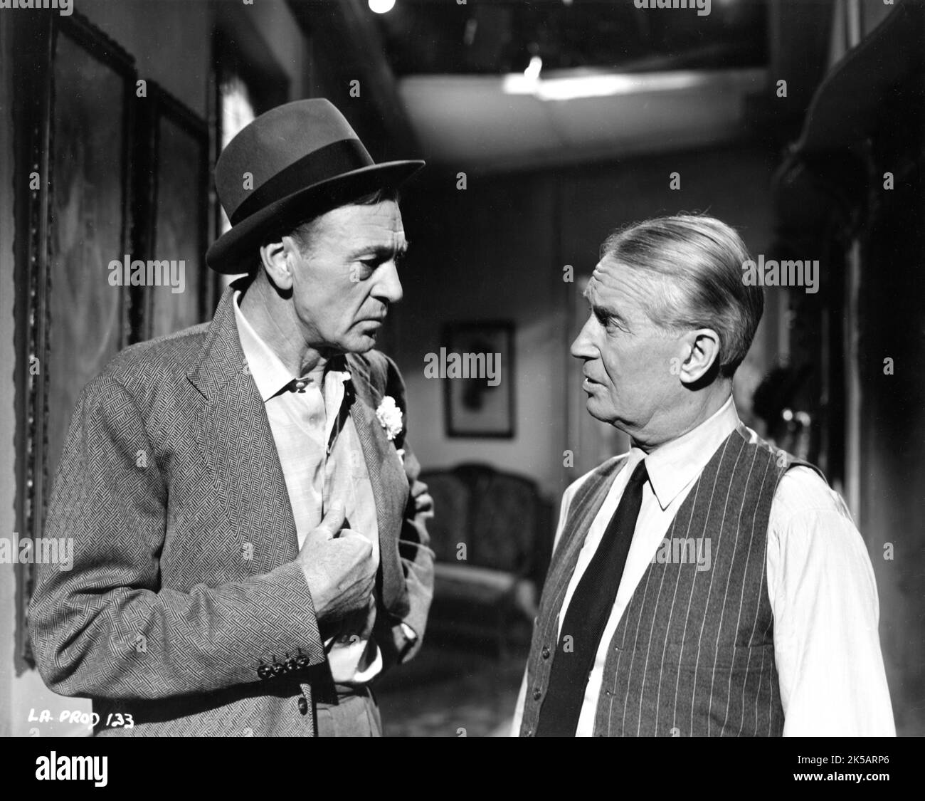 GARY COOPER and MAURICE CHEVALIER on set candid during filming of LOVE