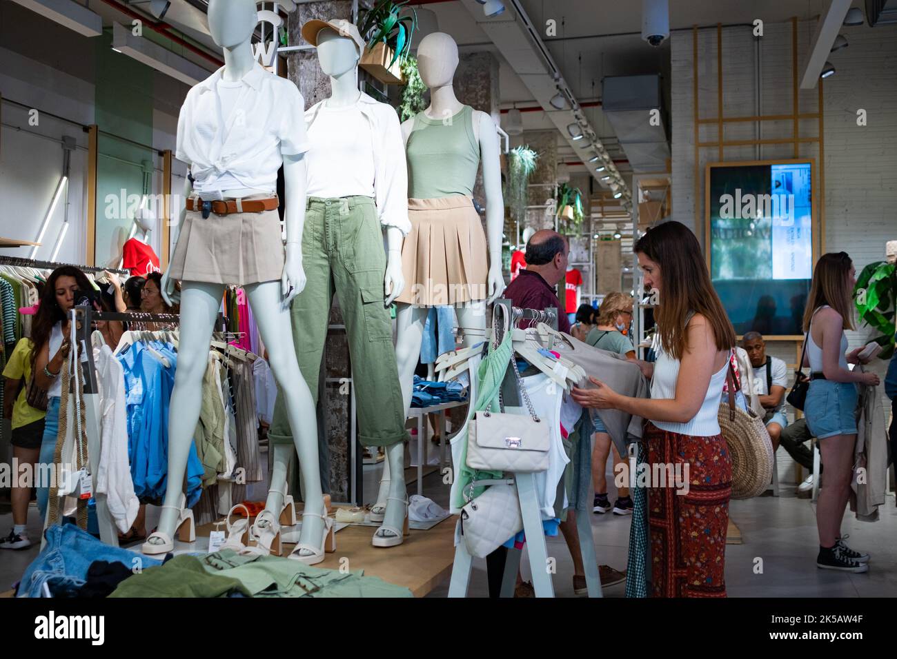 People seen shopping inside a clothing store in the city downtown and ...