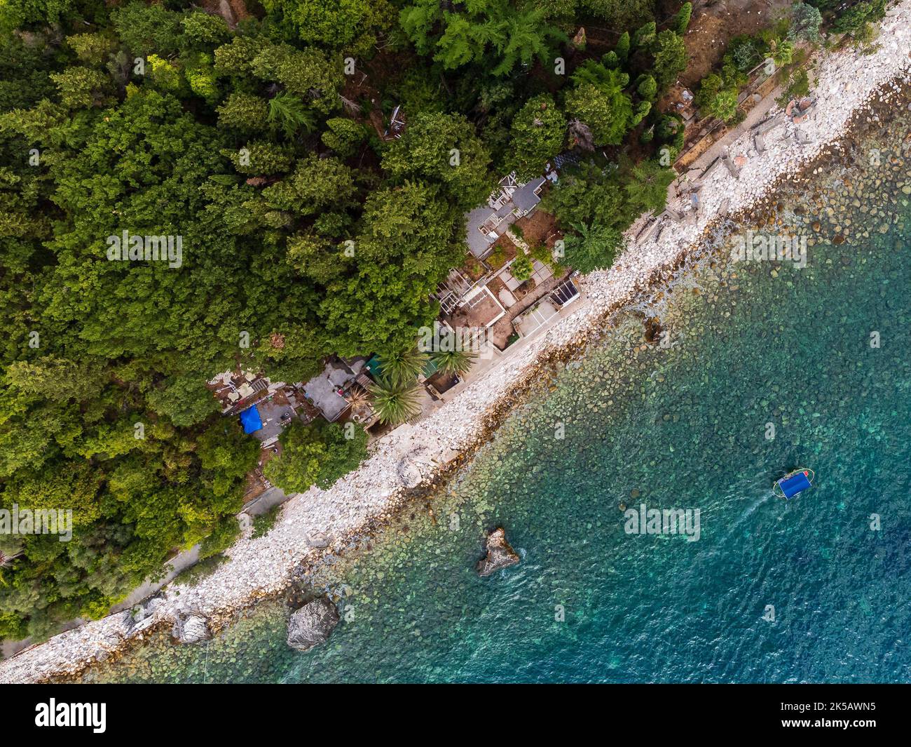 An aerial of Rafailovici beach, Montenegro, Adriatic with a forest ...