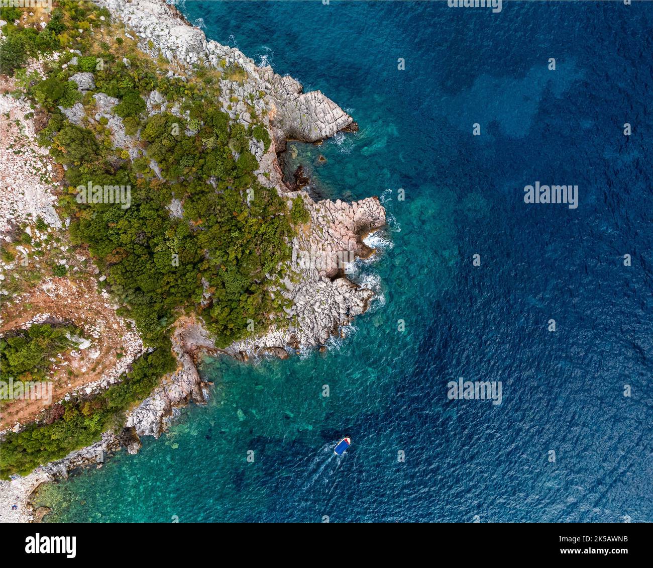 An aerial of Rafailovici beach, Montenegro, Adriatic with a forest ...