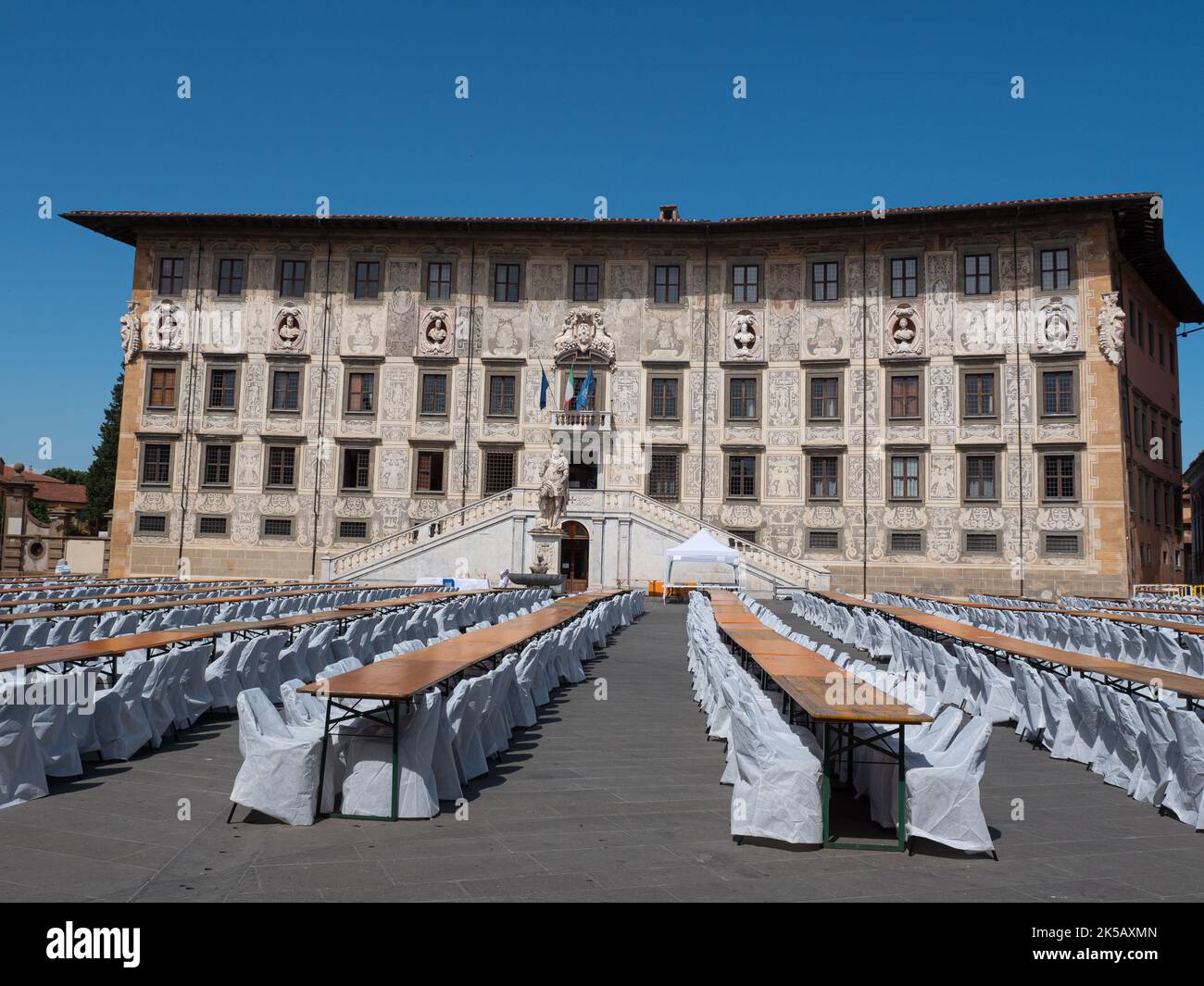 University of Pisa Scuola Normale Superiore With Long Tables and Chairs arranged in the Square. Stock Photo