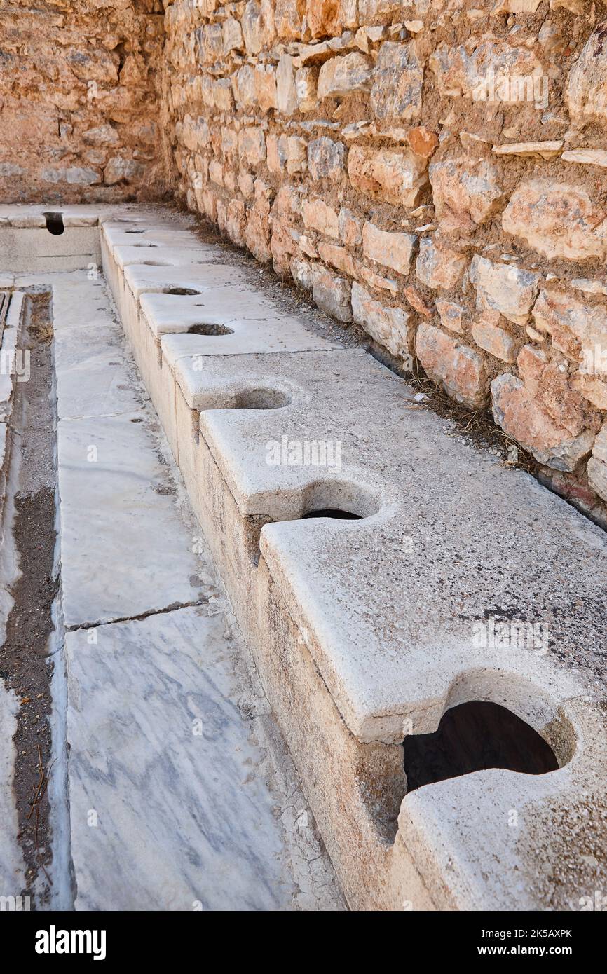 Ancient public toilets in Ephesus archaeological site. Turkish historic landmark Stock Photo Alamy
