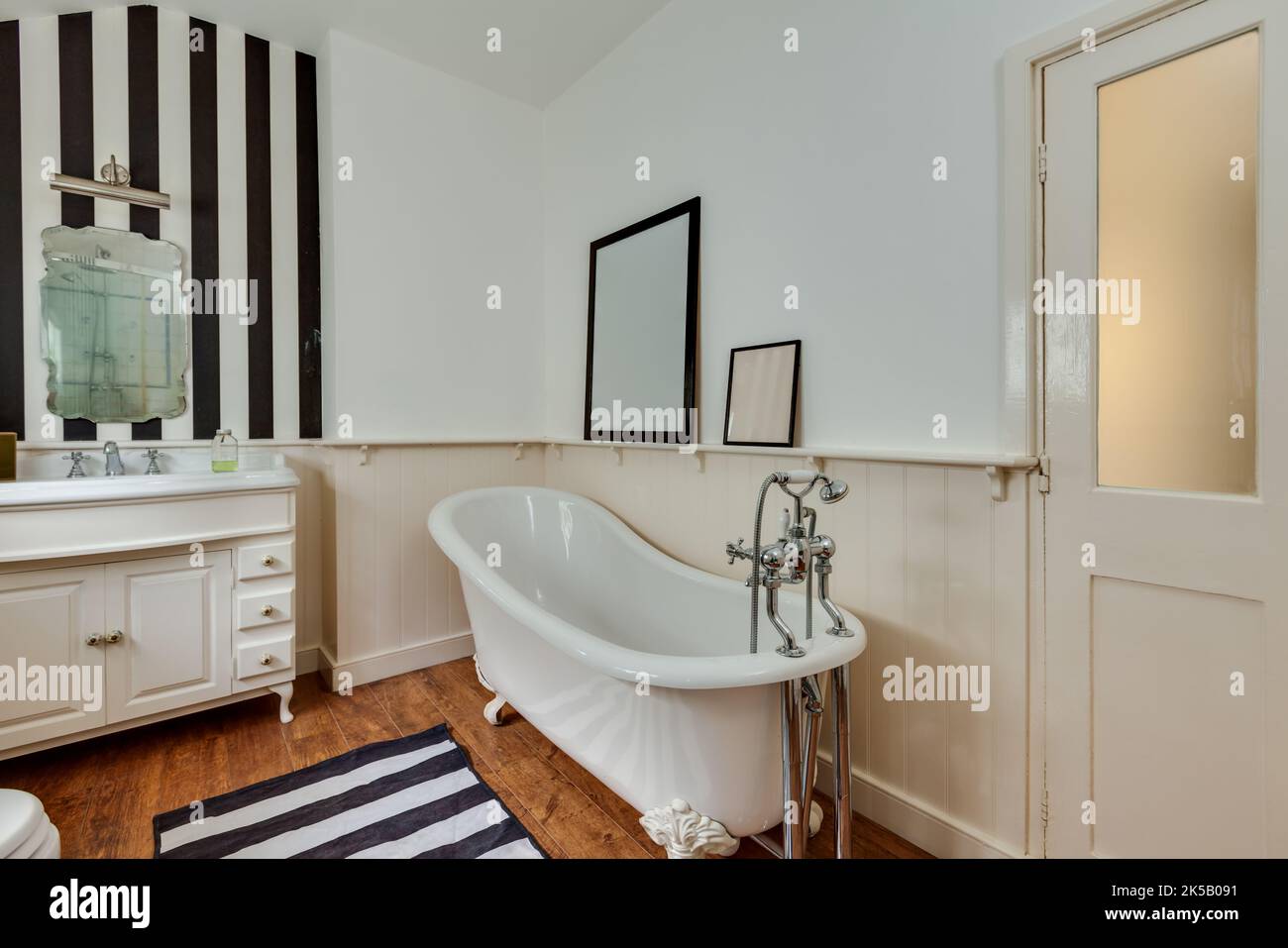 Contemporary modern bathroom with victorian style bathtub Stock Photo - Alamy