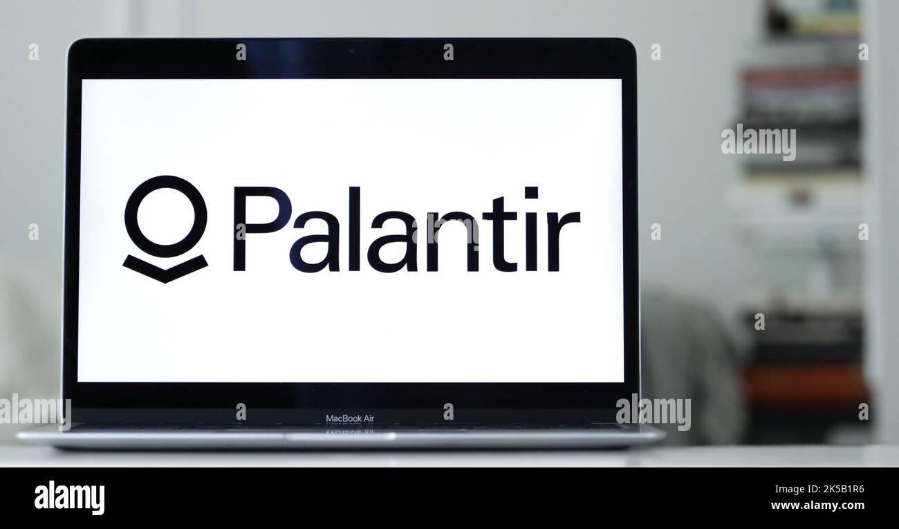 The logo of Palantir displayed on the laptop screen, a big data