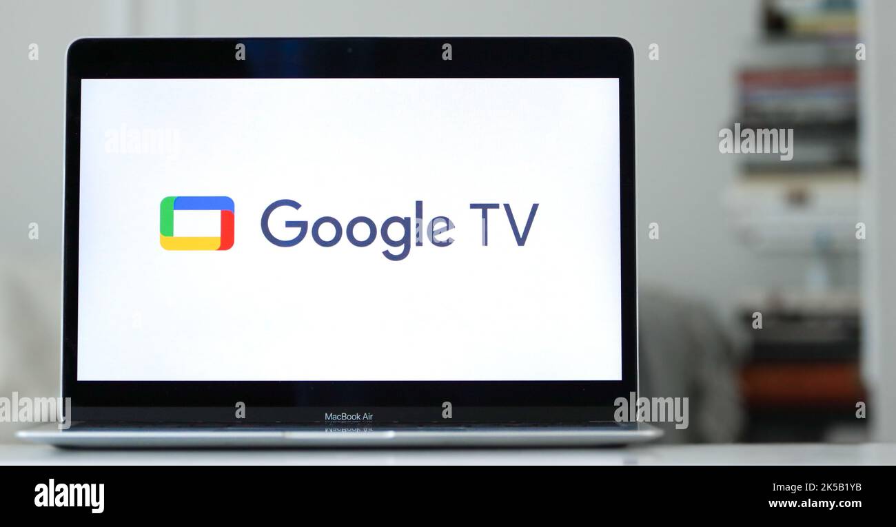 The logo of Google TV displayed on the screen of a laptop Stock Photo
