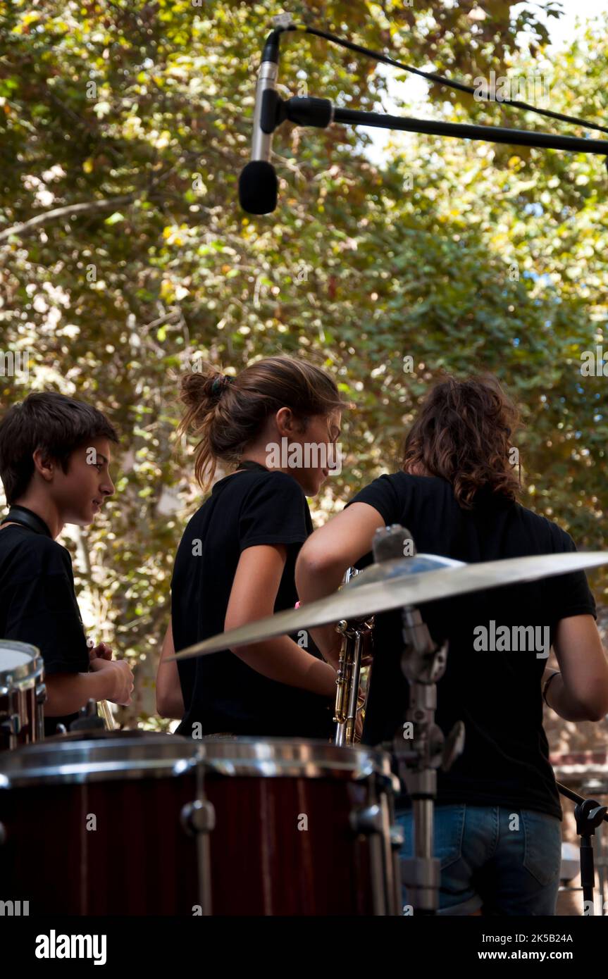 Young musicians playing jazz with Joan Champorro and Andrea Motis, Virreina Square, Vila de Gracia, Barcelona, Spain Stock Photo