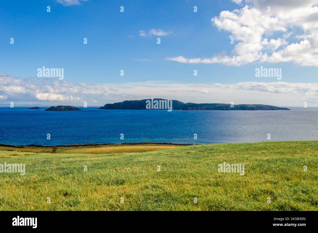 View of Sanda Island and Sheep Island from Southend near the Mull of Kintyre Argyll Scotland on a sunny Summer day with copy space Stock Photo