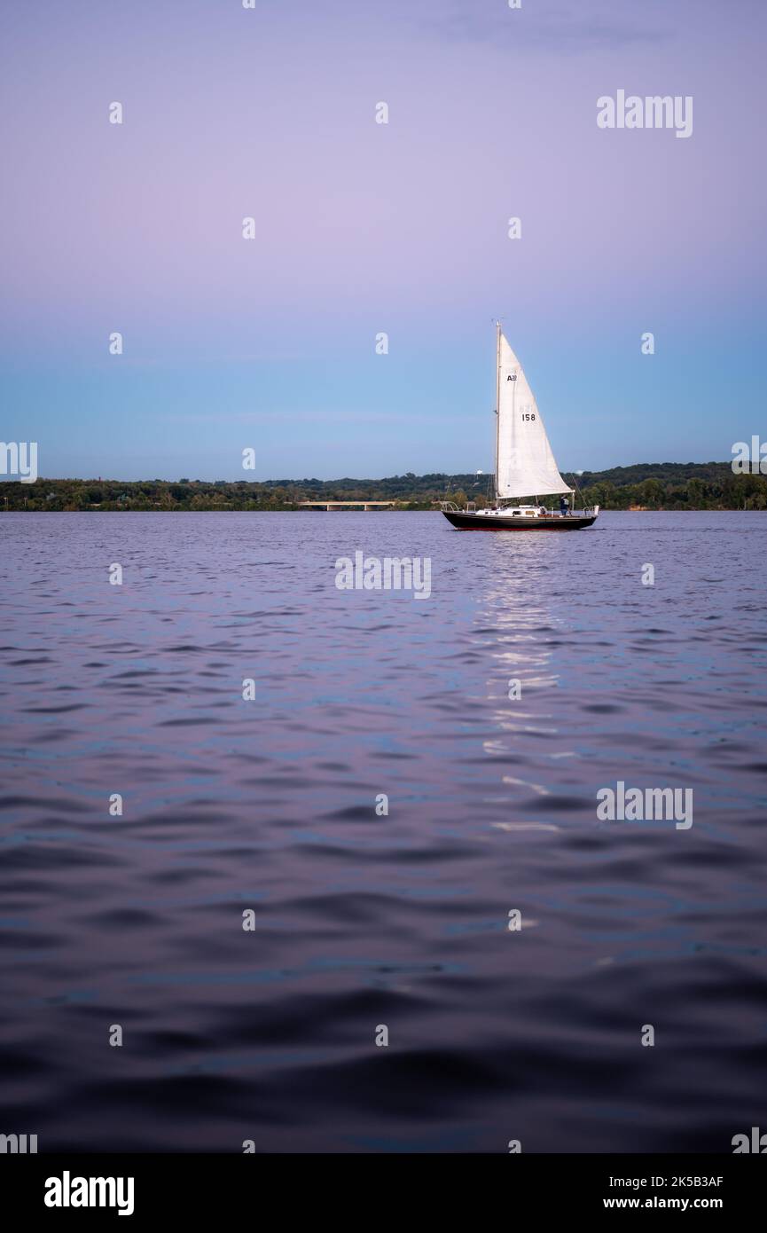 An aerial view of boat sailing on sea during sunset Stock Photo - Alamy