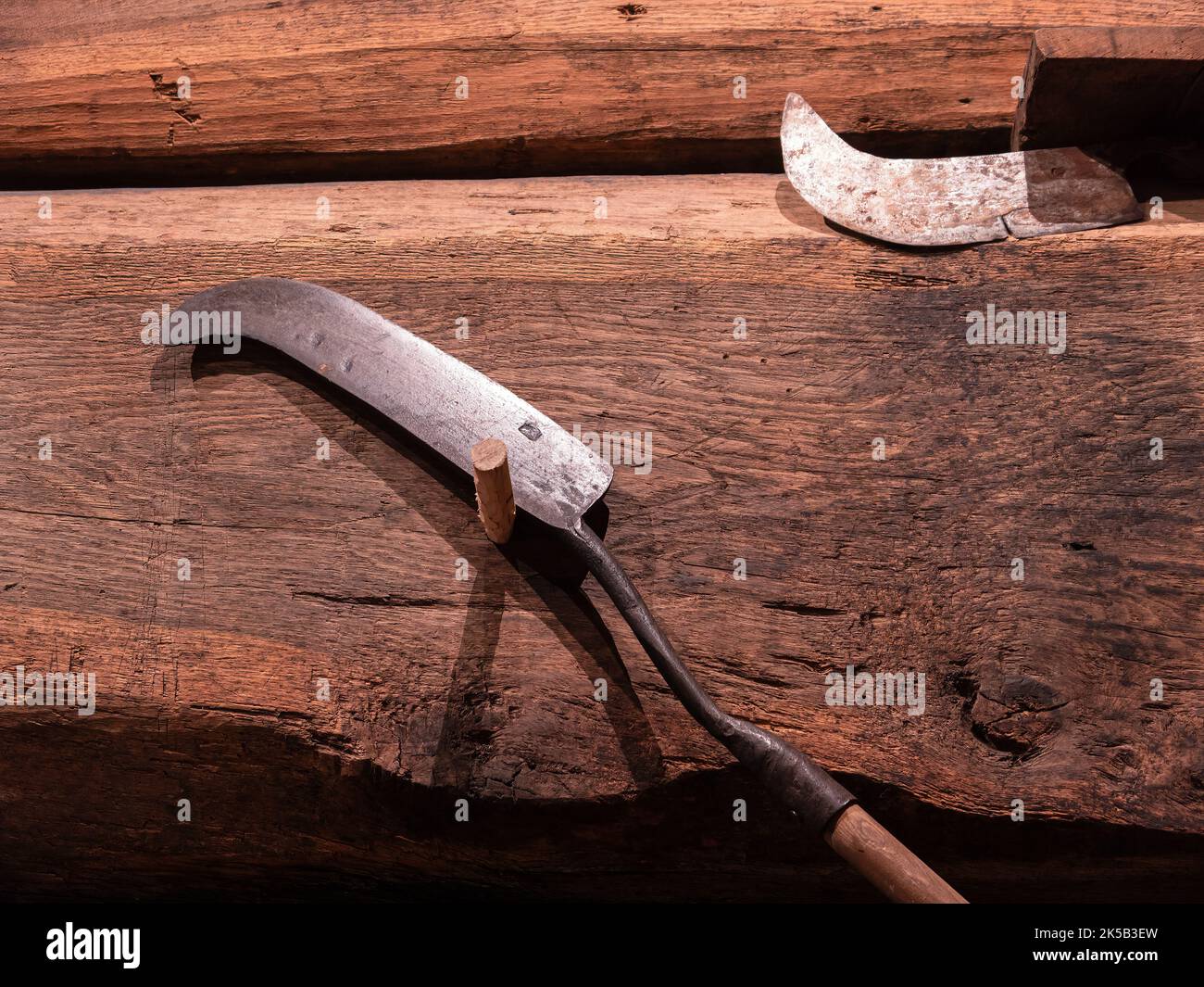 Old metal blade for pruning and chopping vines in a vineyard Stock Photo