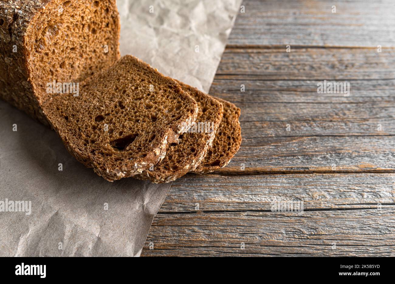 Rye bread on a wooden background. Stock Photo