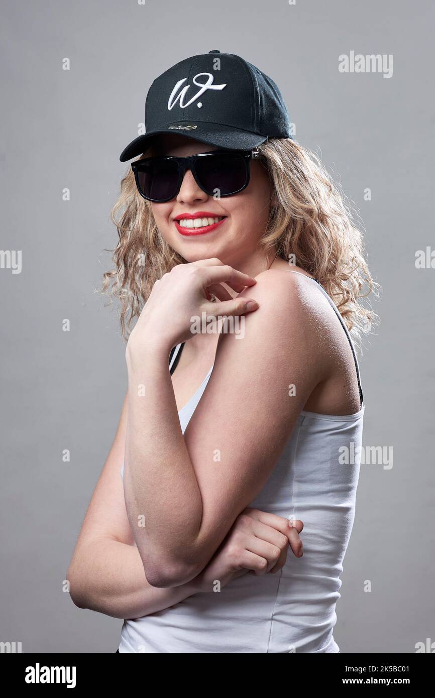 female model inside studio with sunglasses Stock Photo
