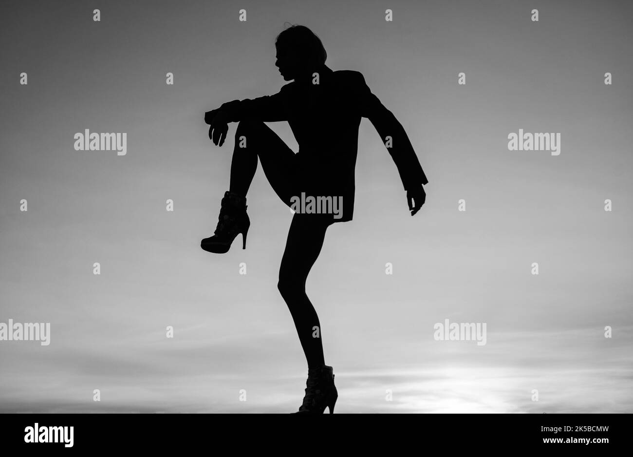 Feel the body. Dancing silhouette. Woman silhouette on evening sky