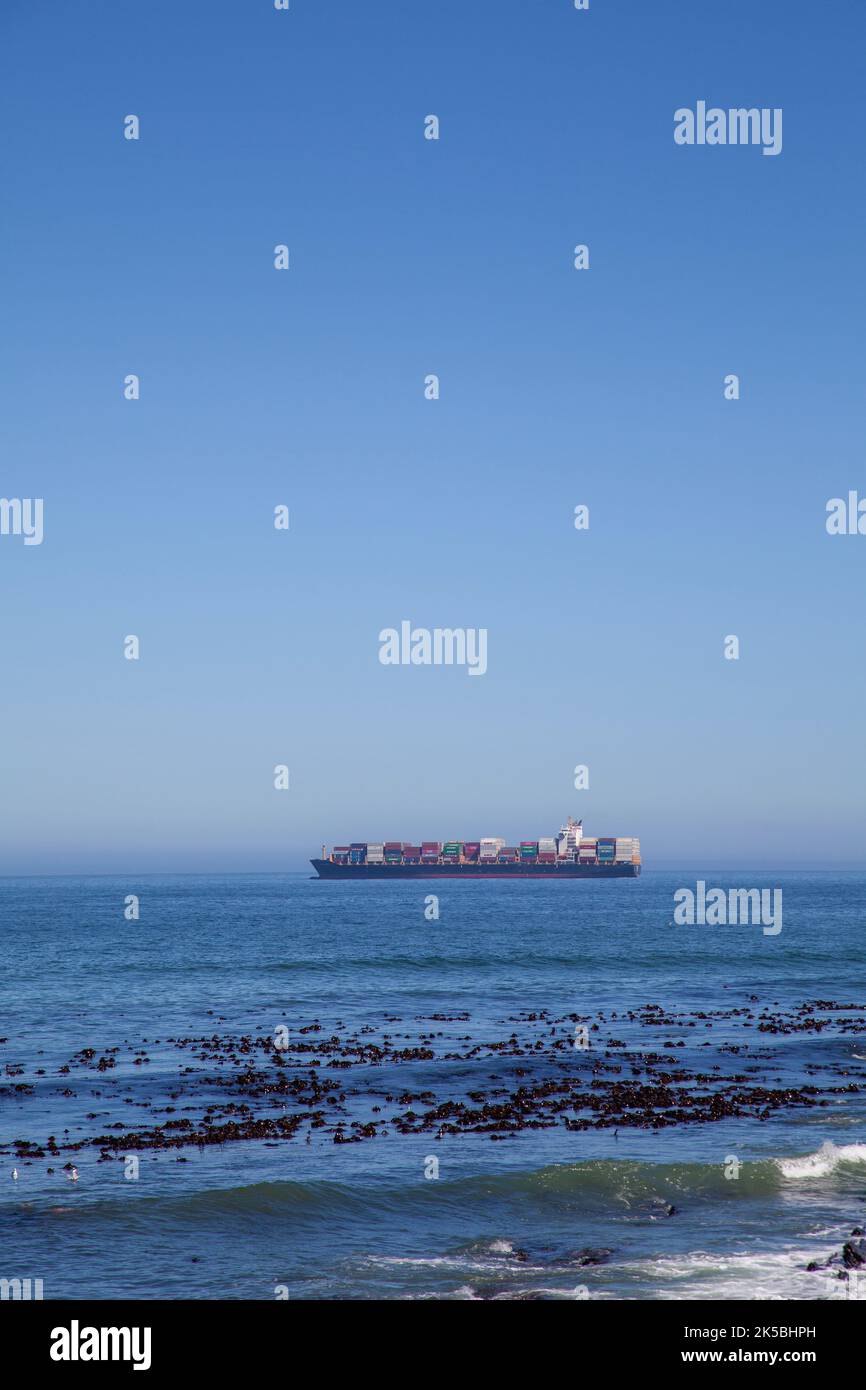 Cargo Ship Heading off Cape Town Waters, South Africa Stock Photo