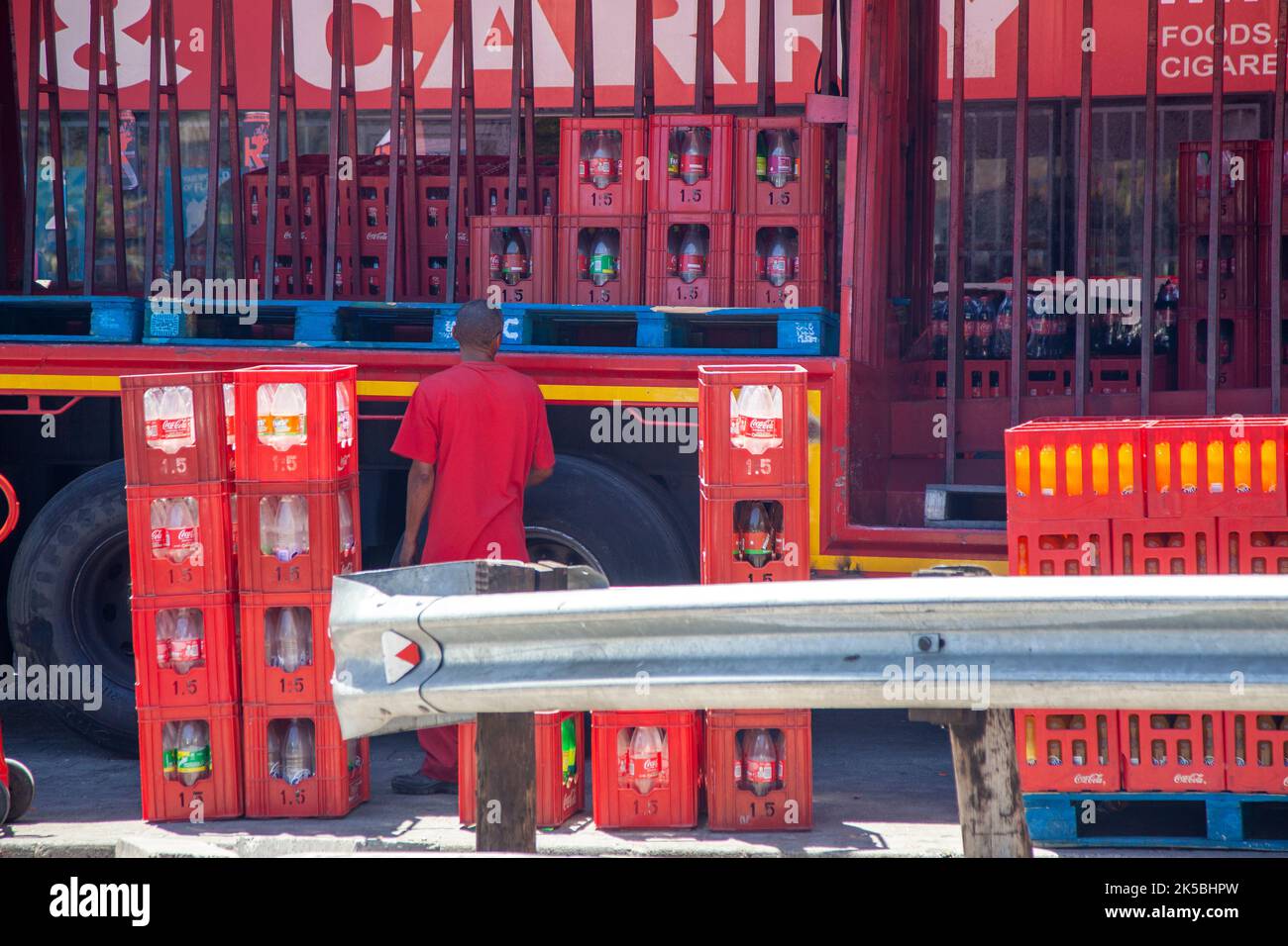 Delivering Bottles of Coca Cola and collecting empties in Cape Town City, South Africa Stock Photo