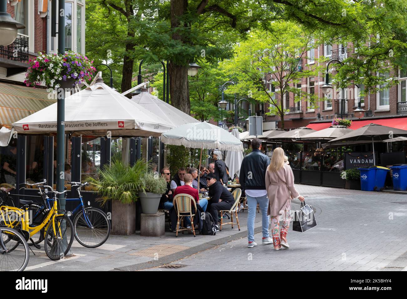 Cozy luxury shopping street with small terraces near the famous