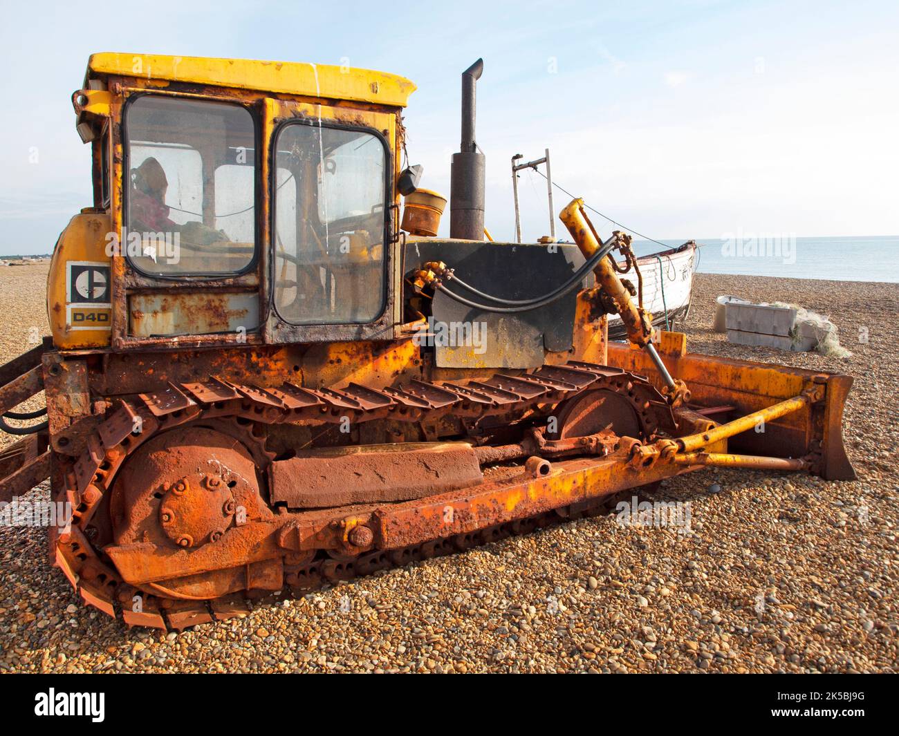 A tractor, used by fishermen sits on the beach at Aldeburgh, Suffolk Stock Photo