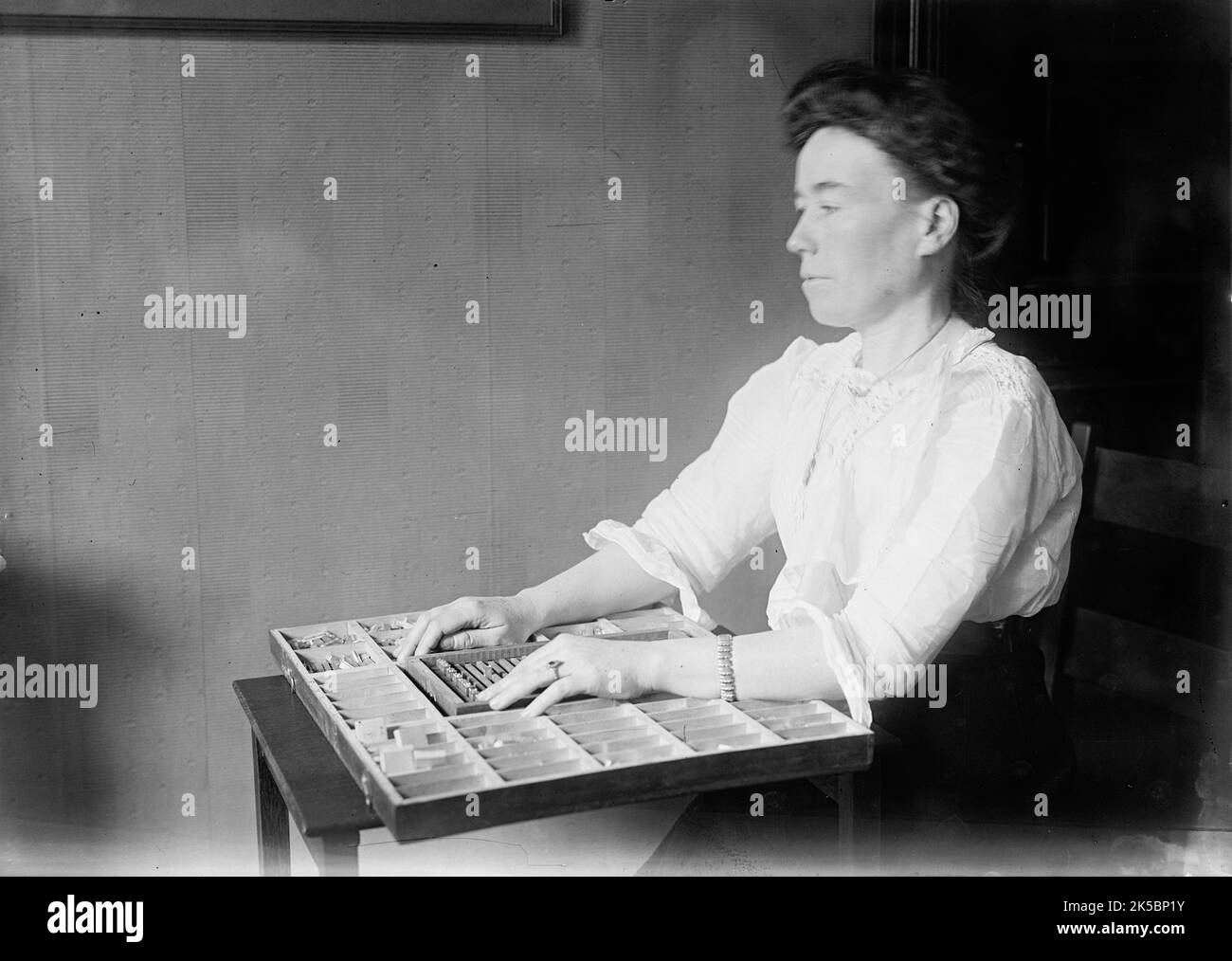 The Blind, Interiors of Library - Institute of The Blind, 1912. Woman with braille type. Stock Photo