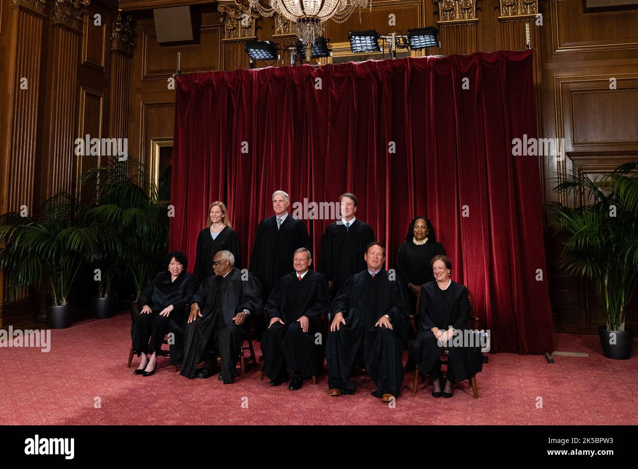 Justices of the US Supreme Court during a formal group photograph at the Supreme Court in Washington, DC, US, on Friday, Oct. 7, 2022. Seated from left: Associate Justice Sonia Sotomayor, Associate Justice Clarence Thomas, Chief Justice John Roberts, Associate Justice Samuel Alito Jr. and Associate Justice Elena Kagan. Standing from left: Associate Justice Amy Coney Barrett, Associate Justice Neil Gorsuch, Associate Justice Brett Kavanaugh and Associate Justice Ketanji Brown Jackson. The court opened its new term Monday with a calendar already full of high-profile clashes, including two case Stock Photo
