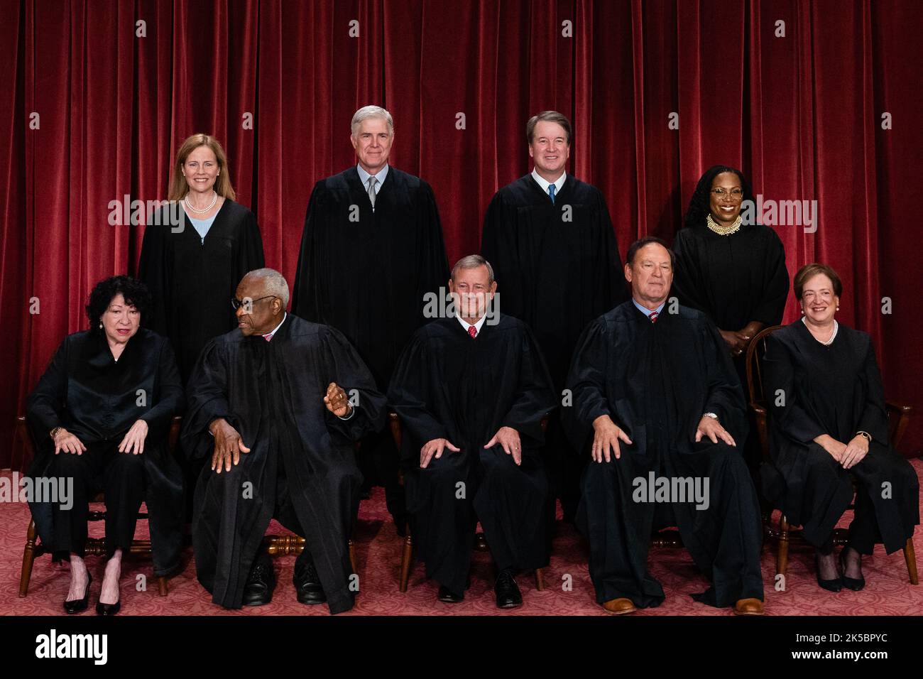 Justices of the US Supreme Court during a formal group photograph at the Supreme Court in Washington, DC, US, on Friday, Oct. 7, 2022. Seated from left: Associate Justice Sonia Sotomayor, Associate Justice Clarence Thomas, Chief Justice John Roberts, Associate Justice Samuel Alito Jr. and Associate Justice Elena Kagan. Standing from left: Associate Justice Amy Coney Barrett, Associate Justice Neil Gorsuch, Associate Justice Brett Kavanaugh and Associate Justice Ketanji Brown Jackson. The court opened its new term Monday with a calendar already full of high-profile clashes, including two case Stock Photo