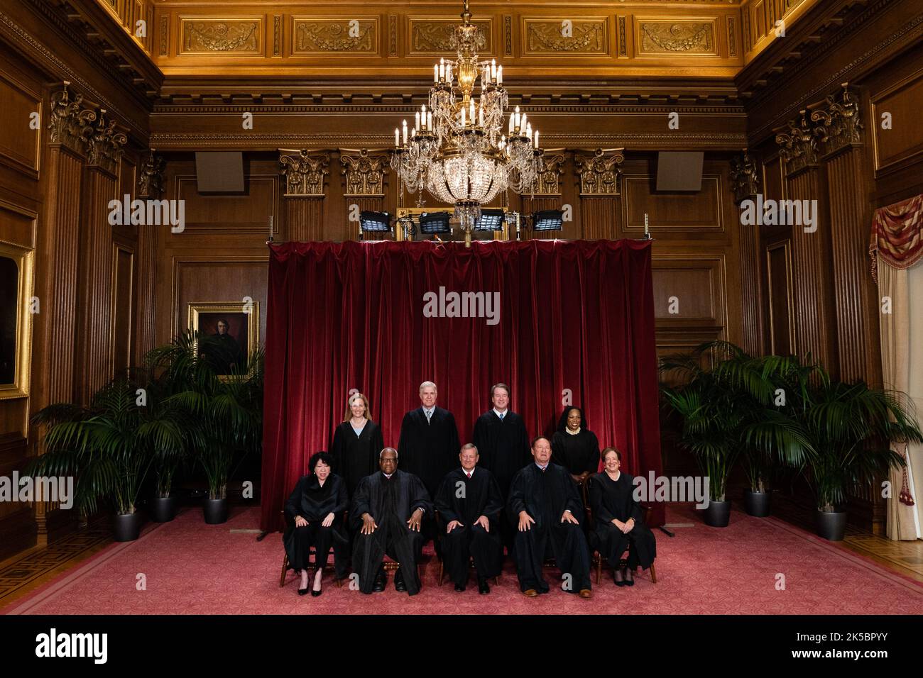 Justices of the US Supreme Court during a formal group photograph at the Supreme Court in Washington, DC, US, on Friday, Oct. 7, 2022. Seated from left: Associate Justice Sonia Sotomayor, Associate Justice Clarence Thomas, Chief Justice John Roberts, Associate Justice Samuel Alito Jr. and Associate Justice Elena Kagan. Standing from left: Associate Justice Amy Coney Barrett, Associate Justice Neil Gorsuch, Associate Justice Brett Kavanaugh and Associate Justice Ketanji Brown Jackson. The court opened its new term Monday with a calendar already full of high-profile clashes, including two case Stock Photo