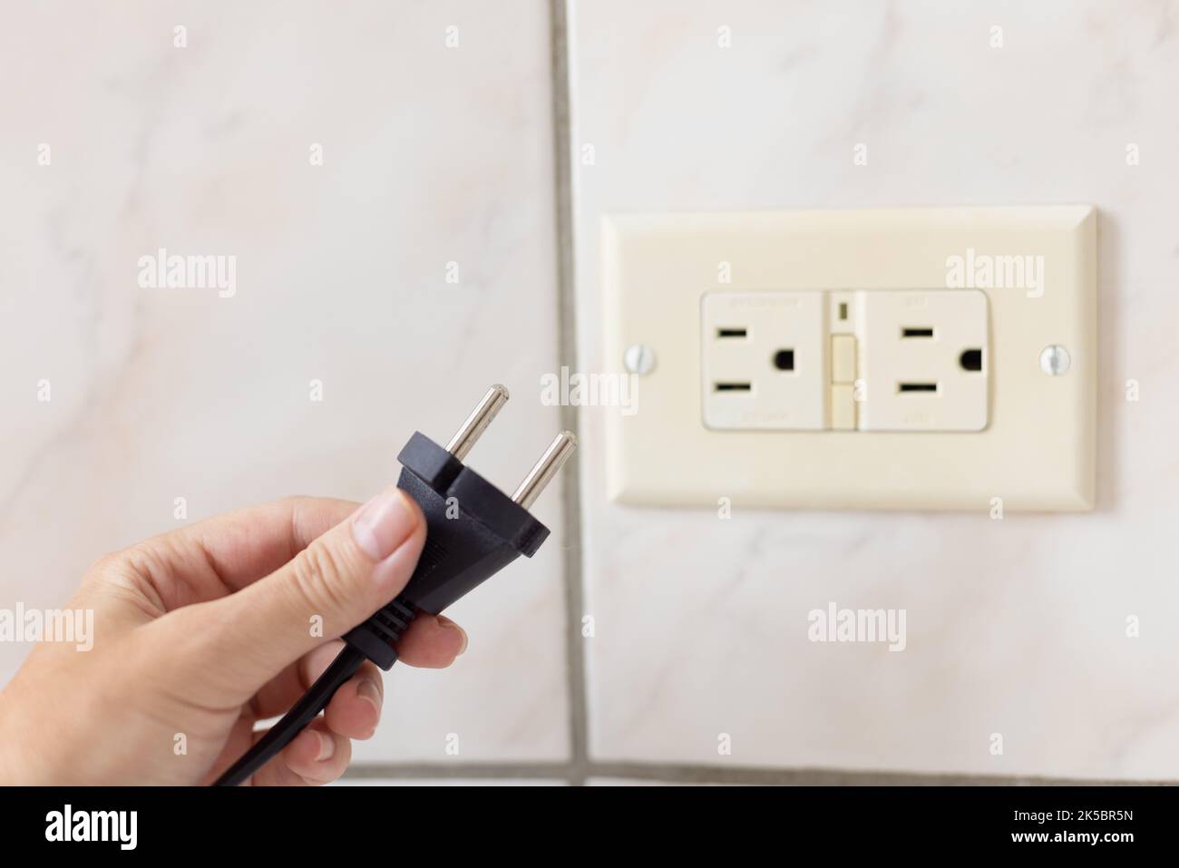 Power cable doesnt feet to the electrical plug type B Stock Photo Alamy