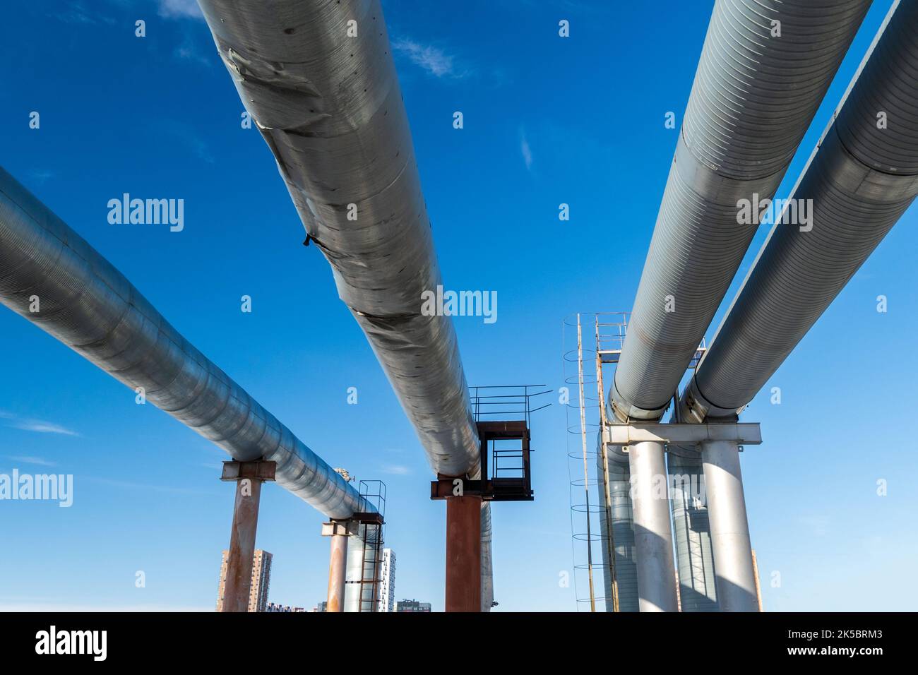 Pipeline protected by stainless steel insulation to maintain ambient temperature, winter Stock Photo