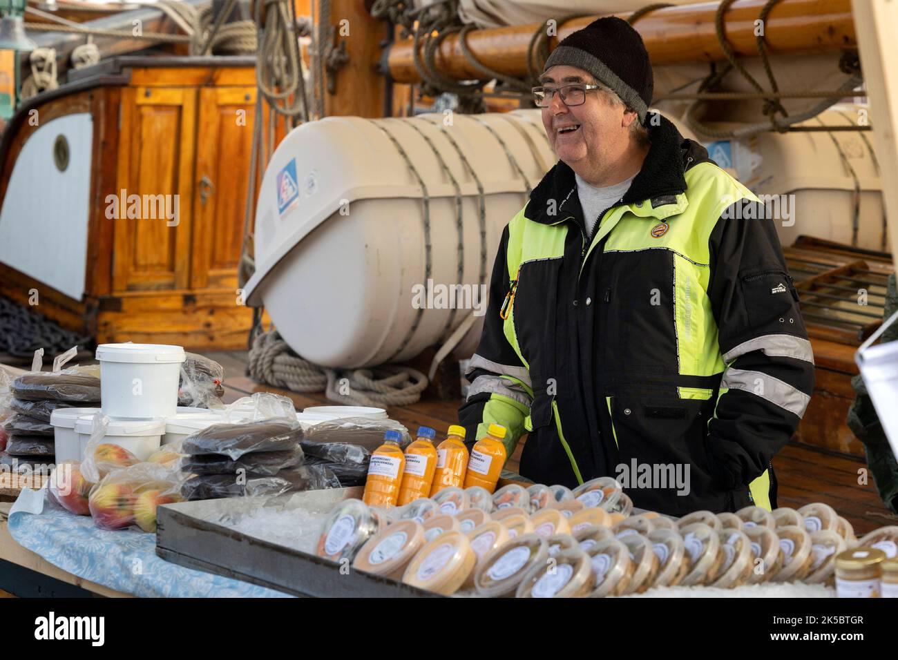 Helsinki, Finland. 7th Oct, 2022. A vendor talks to customers at his