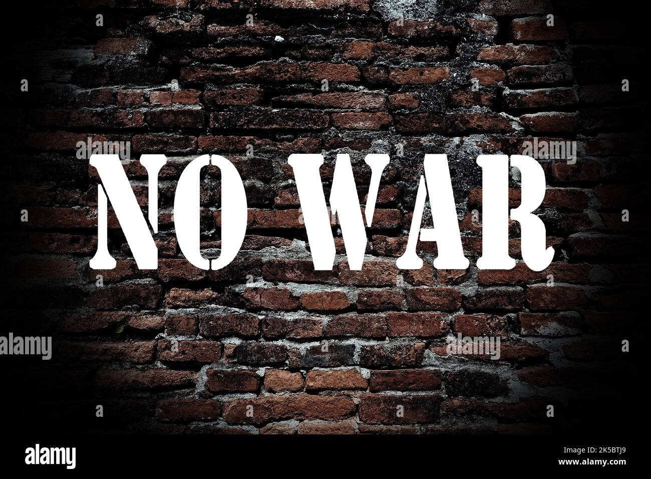No war banner on ruined brick wall background. The concept of peace and goodness. Stock Photo