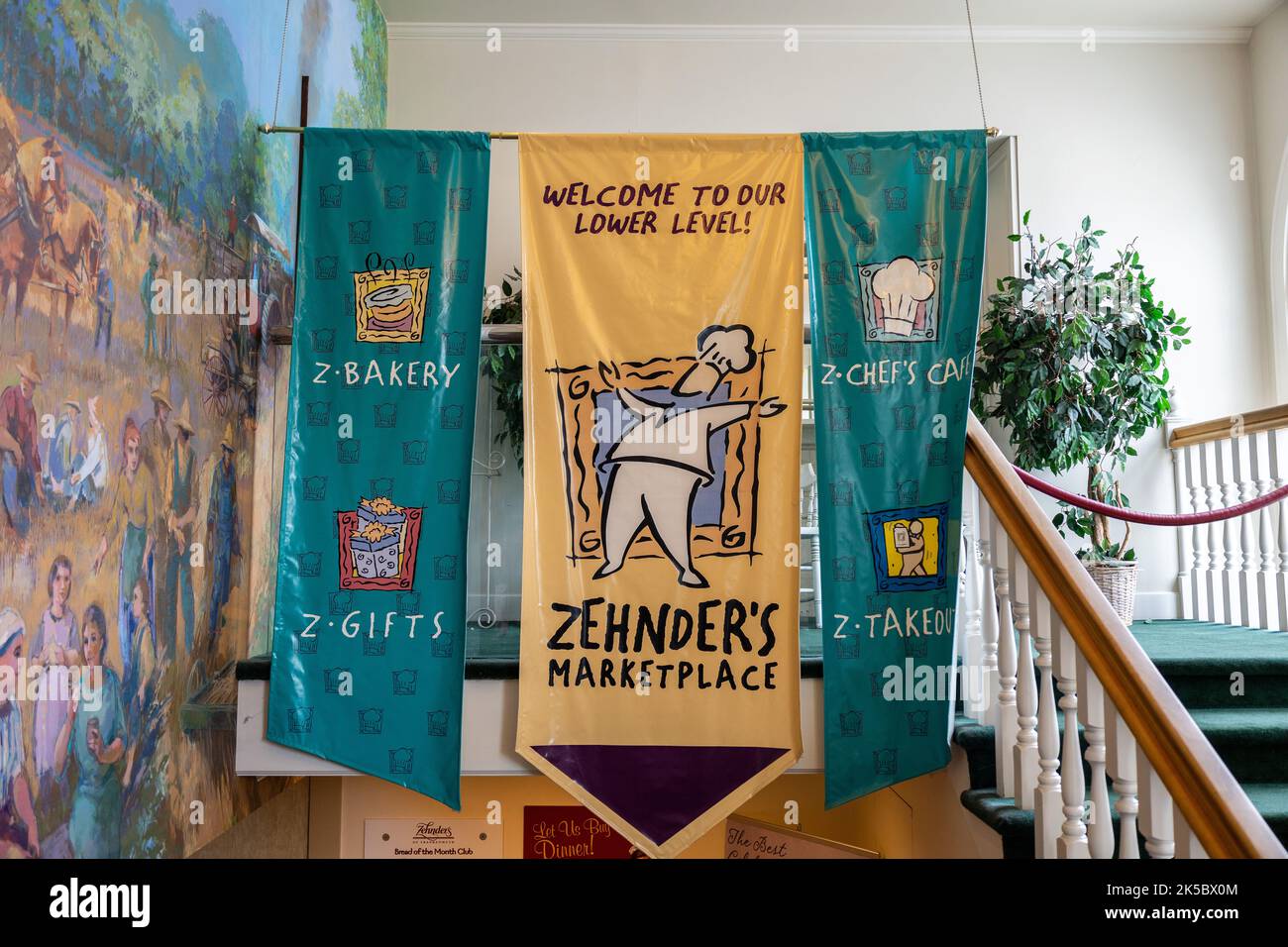 Zehnders Marketplace Signs To The Lower Level Shops And Cafe In The Basement Of Zehnder's Famous Chicken Restaurant Frankenmuth Michigan USA Stock Photo