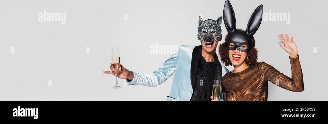 Shot couple masks holding hi-res stock photography and images - Alamy