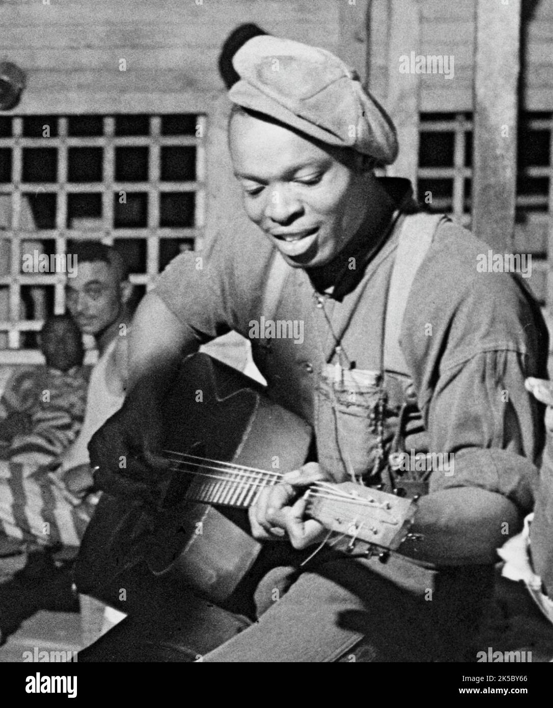 Jack Delano - Buddy Moss playing guitar, Convict Camp, Greene County