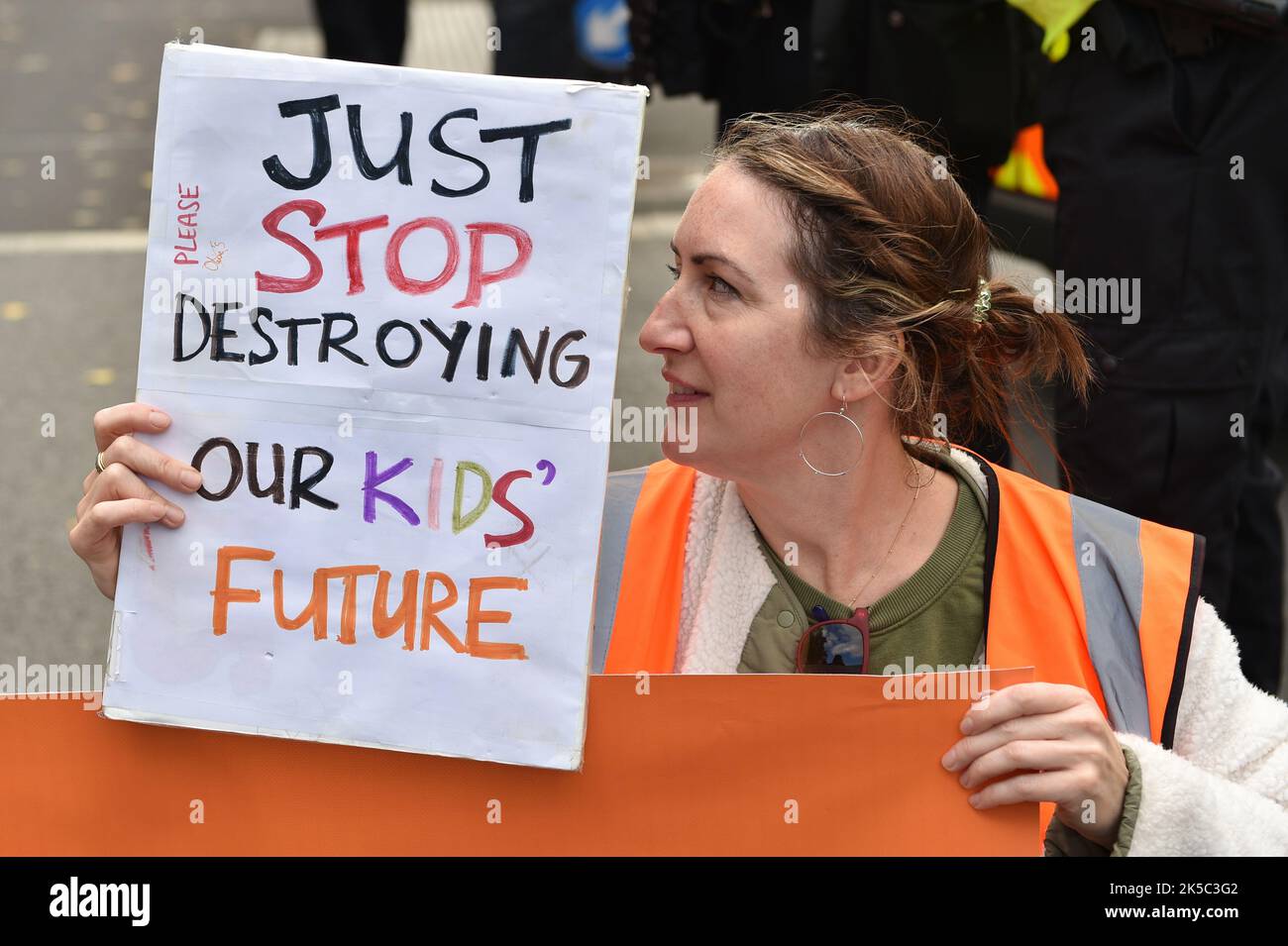 London, UK. 07th Oct, 2022. A Protester Holds A Placard Expressing Her ...