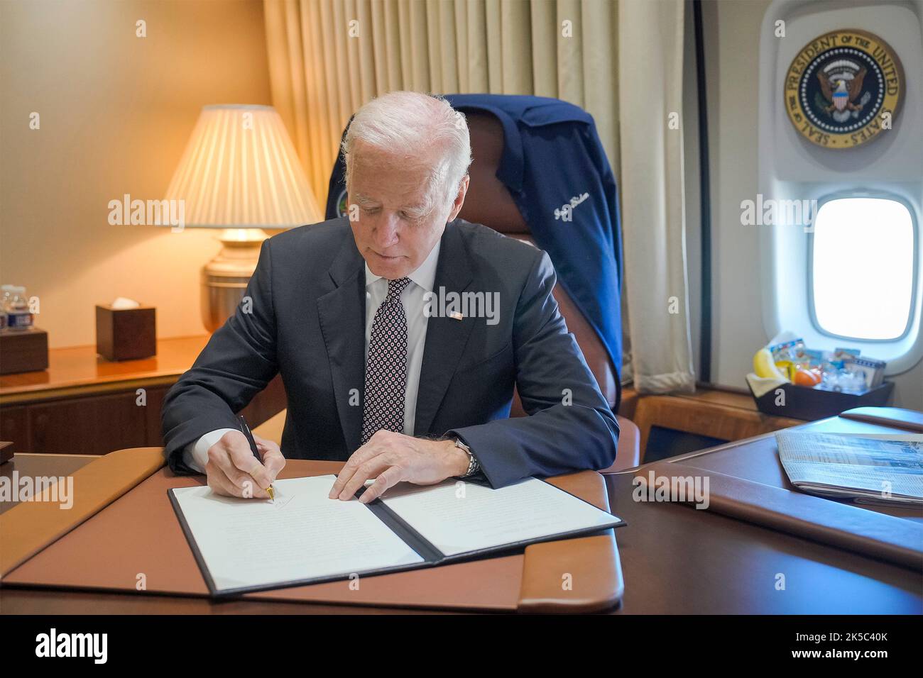 Poughkeepsie, United States. 06th Oct, 2022. U.S. President Joe Biden, signs a pardon for all people convicted of simple marijuana possession under federal law at his office aboard Air Force One, October 6, 2022, on the way to Poughkeepsie, New York. Credit: Adam Schultz/White House Photo/Alamy Live News Stock Photo