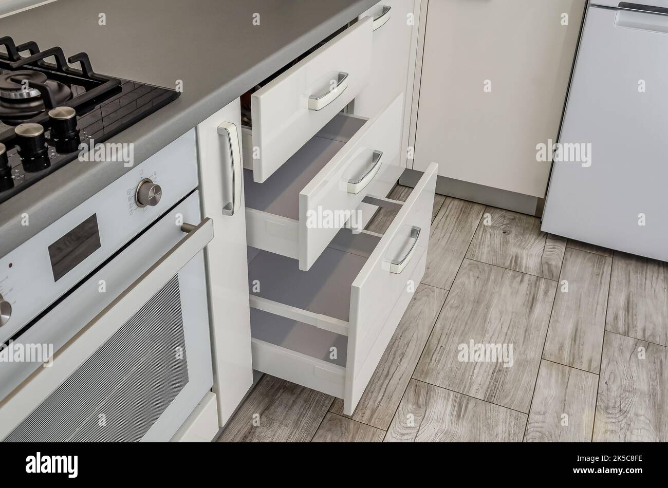 White kitchen set, bedside table with drawers. Stock Photo