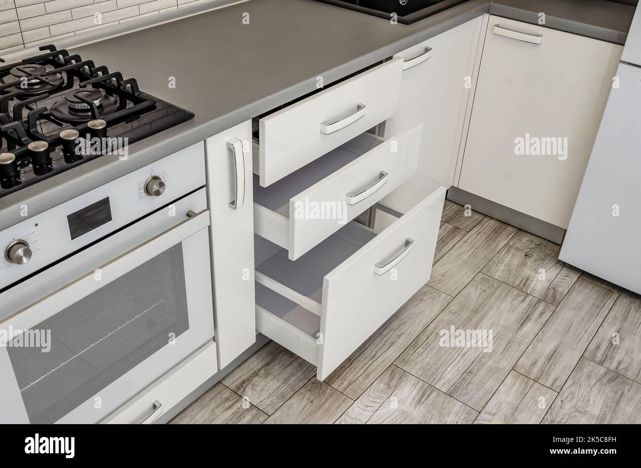 White kitchen set, bedside table with drawers. Stock Photo