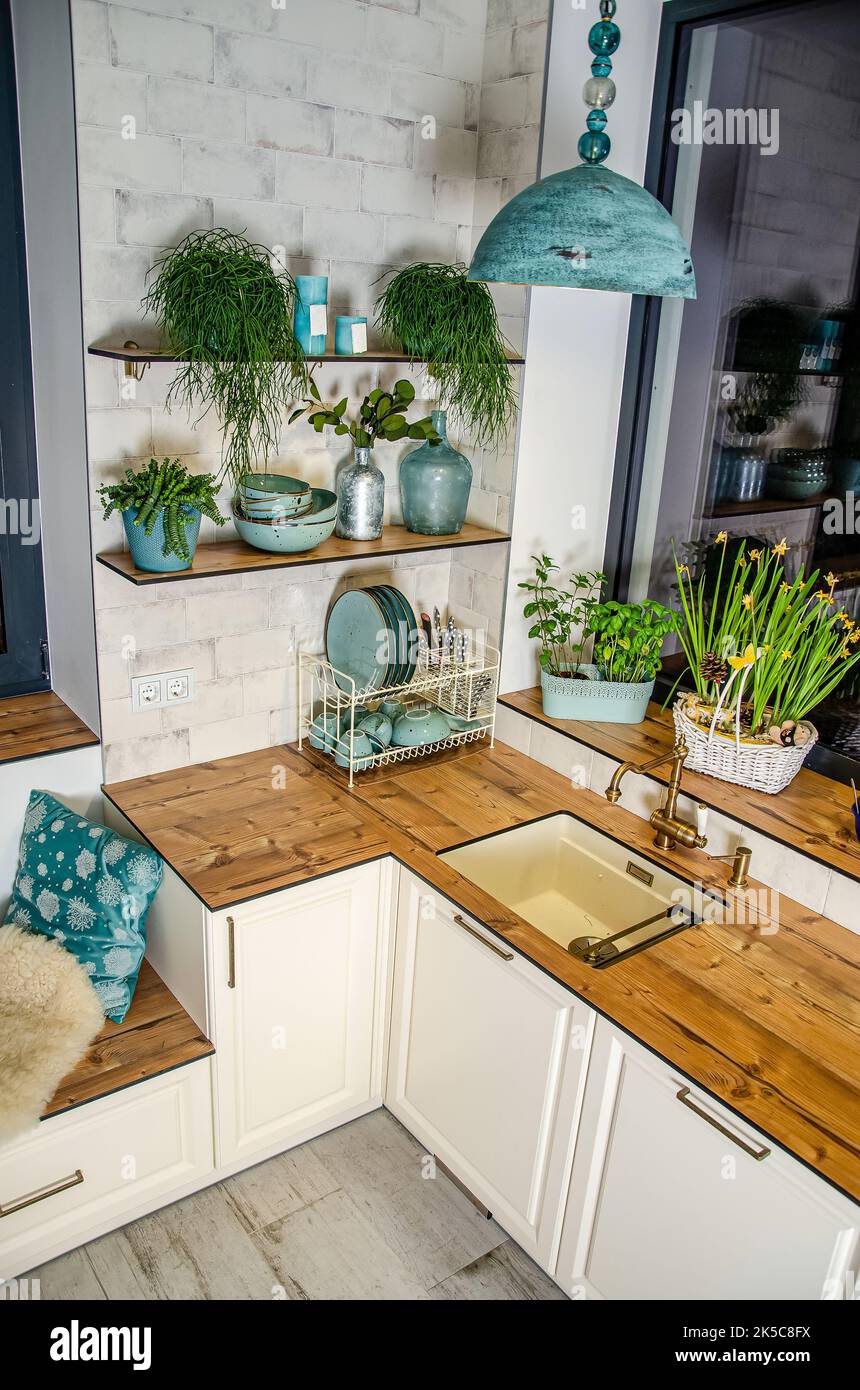 Kitchen furniture, wooden worktop, white door, corner sink Stock Photo