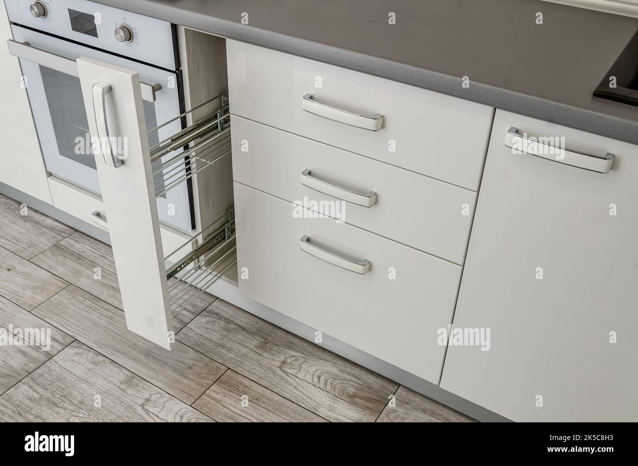 White kitchen set, bedside table with drawers. Stock Photo