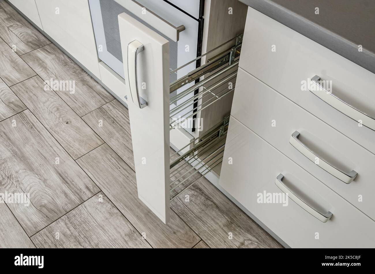 White kitchen set, bedside table with drawers. Stock Photo