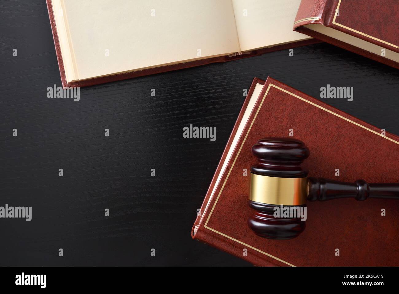 Detail of background of judge's gavel on white table and black isolated background. Top view Stock Photo