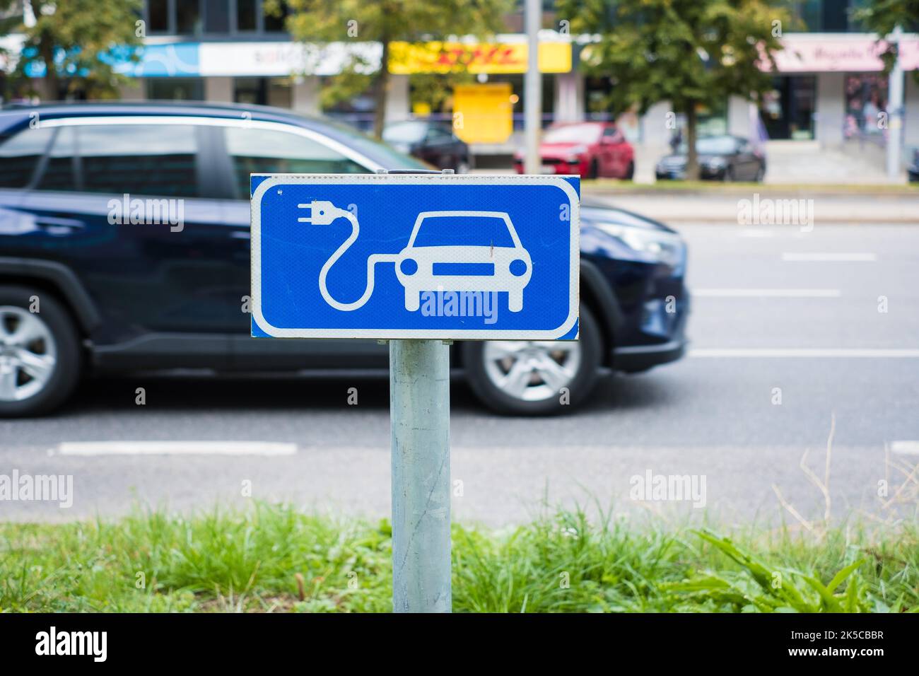 Public electrical vehicle charging point traffic sign. Stock Photo