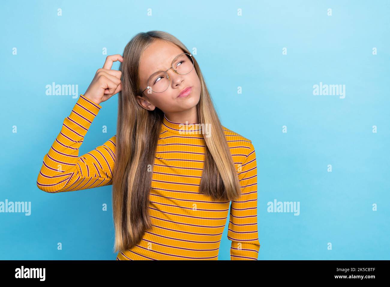 Portrait of smart minded person finger scratch head look empty space
