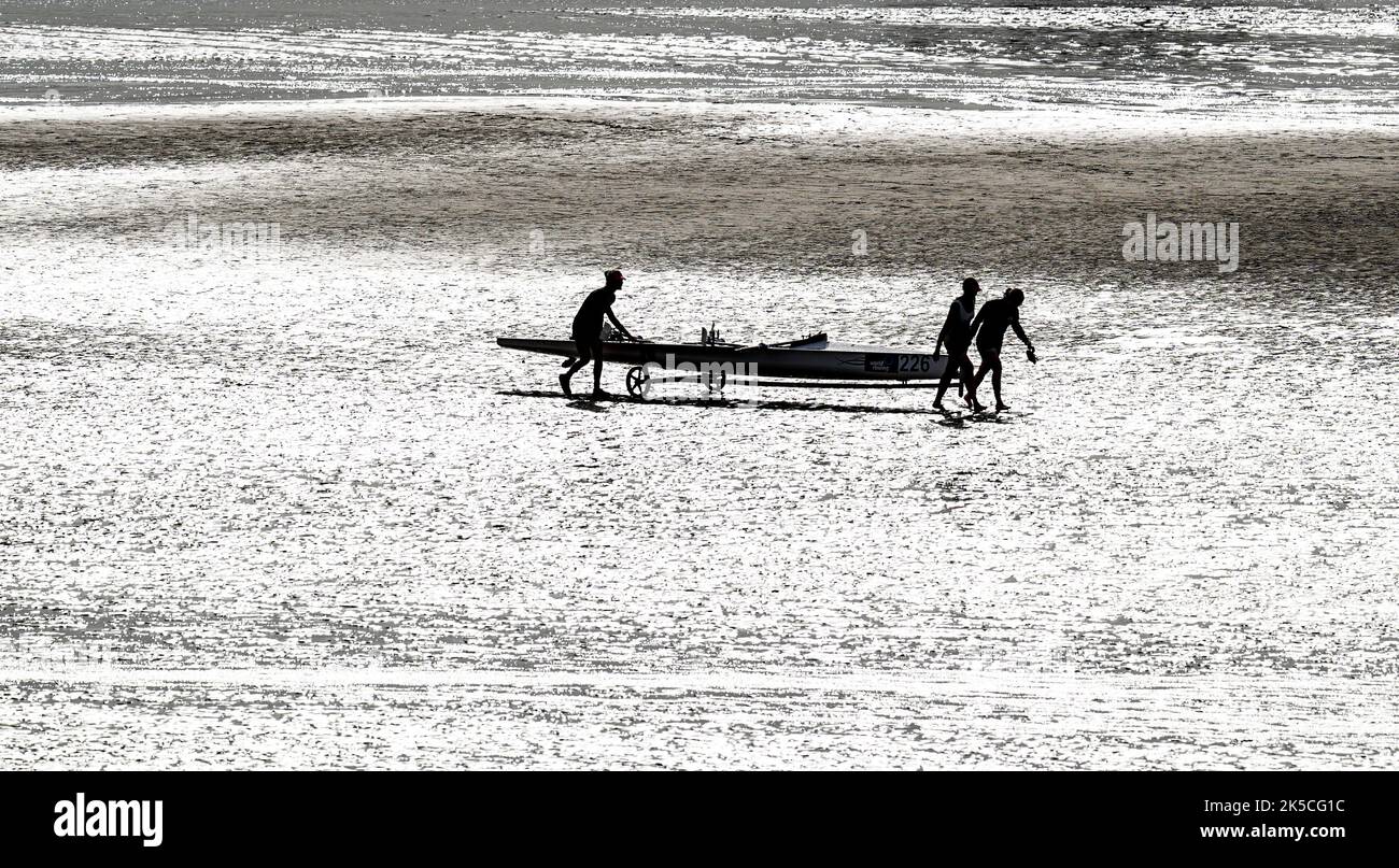 Competitors with their boat during the World Rowing Championships and Beach Sprint, at Saundersfoot, Wales. Picture date: Friday October 7, 2022. Stock Photo